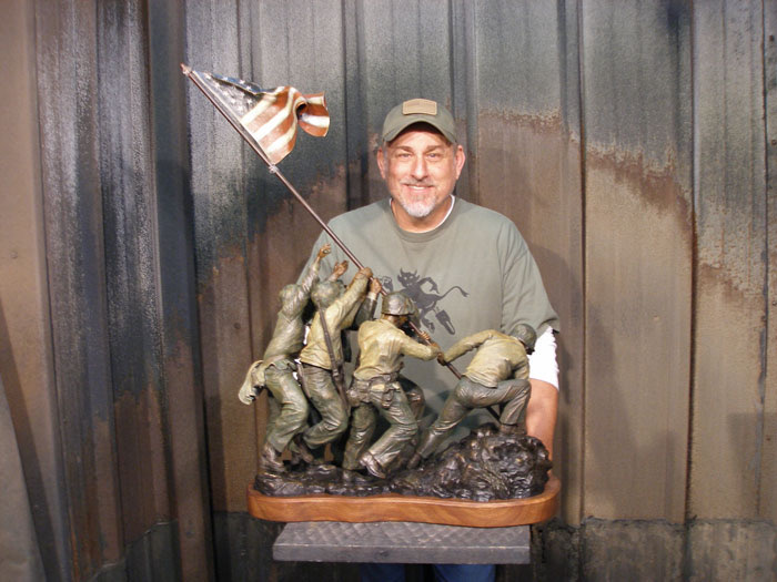 David Paul Venell working on a bronze sculpture in his studio